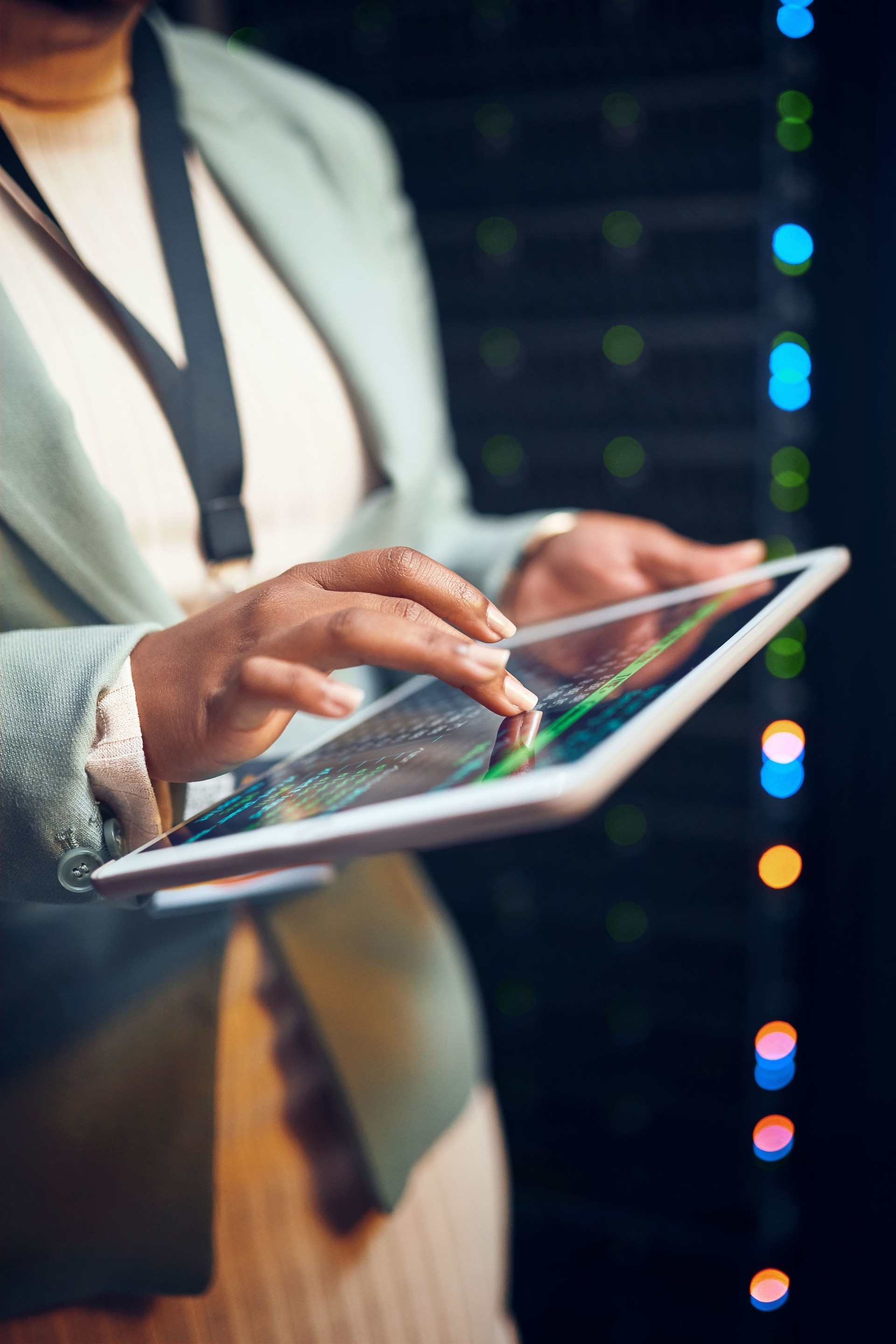 Closeup shot of an unrecognisable woman using a digital tablet while working in a server room